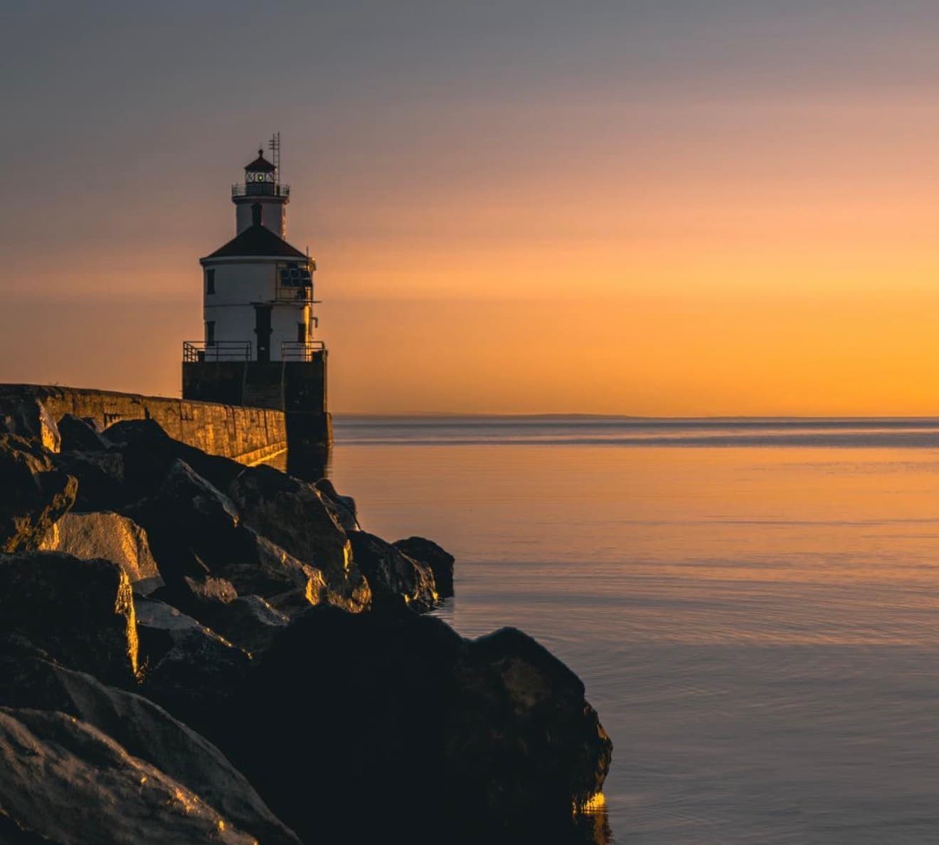 Duluth South Pier lighthouse on a calm evening at sunset